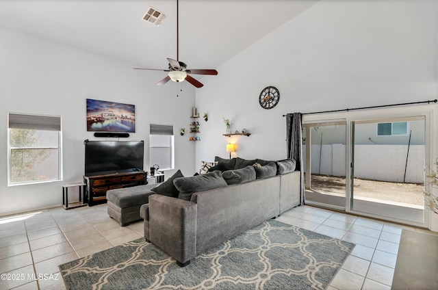 5273 W Fireopal Way, Tucson, AZ 85742 - living room with high vaulted ceiling, light tile patterned floors, ceiling fan, and visible vents