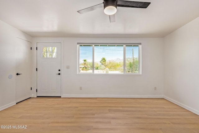 foyer featuring light wood-style floors, ceiling fan, and baseboards