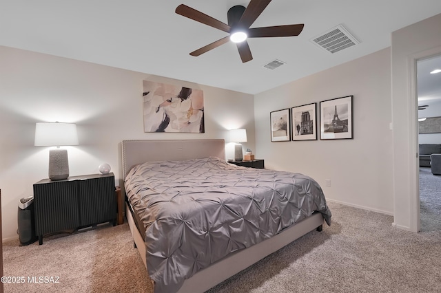carpeted bedroom featuring visible vents and a ceiling fan