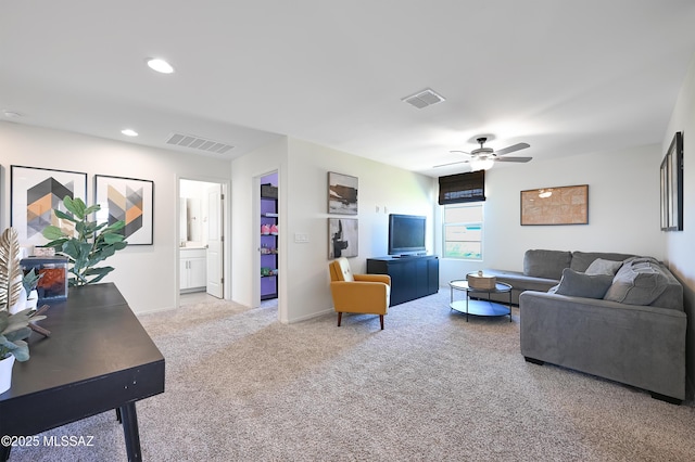 living room with recessed lighting, a ceiling fan, visible vents, and carpet