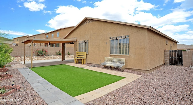 3581 W Avenida Vera Cruz, Tucson, AZ 85746 - back of property featuring a patio, stucco siding, and a fenced backyard