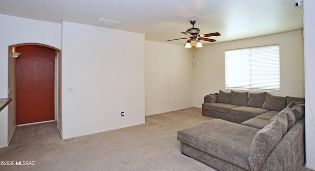 3581 W Avenida Vera Cruz, Tucson, AZ 85746 - living area with light carpet, ceiling fan, and arched walkways