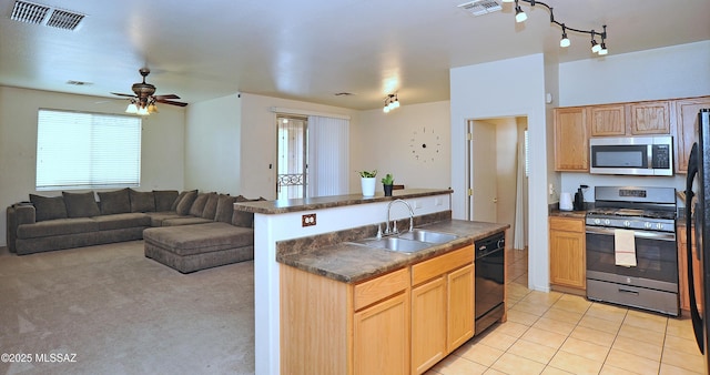 3581 W Avenida Vera Cruz, Tucson, AZ 85746 - kitchen featuring stainless steel appliances, dark countertops, light brown cabinets, ceiling fan, and open floor plan