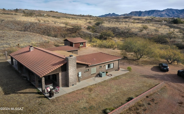 birds eye view of property with a rural view and a mountain view