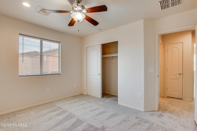 unfurnished bedroom with light carpet, baseboards, and visible vents