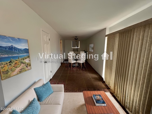 hall featuring dark tile patterned flooring