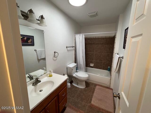 full bathroom with tile patterned flooring, shower / bath combination with curtain, toilet, vanity, and visible vents
