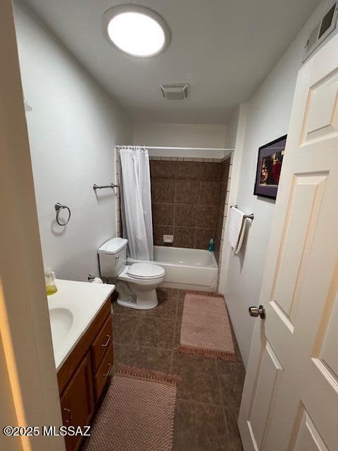 full bathroom featuring visible vents, toilet, tile patterned flooring, and vanity