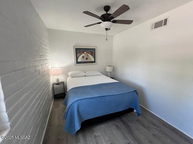 bedroom featuring dark wood-style floors and ceiling fan