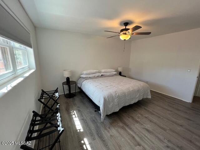 full bath with tile patterned floors, toilet, a tile shower, and vanity