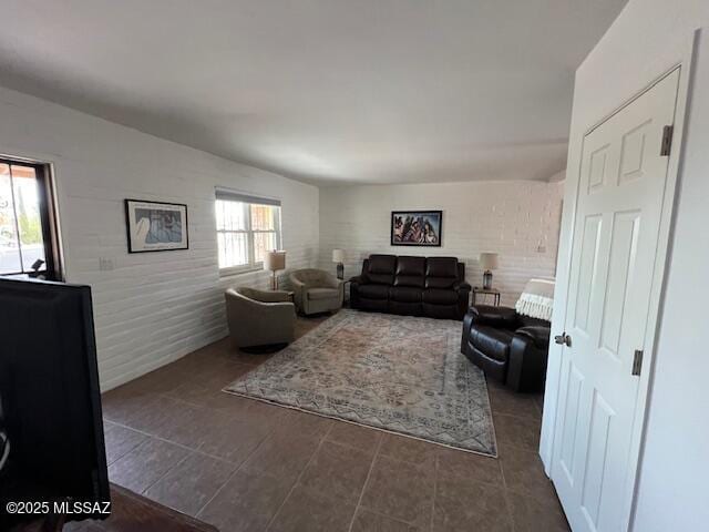 living area with dark tile patterned floors