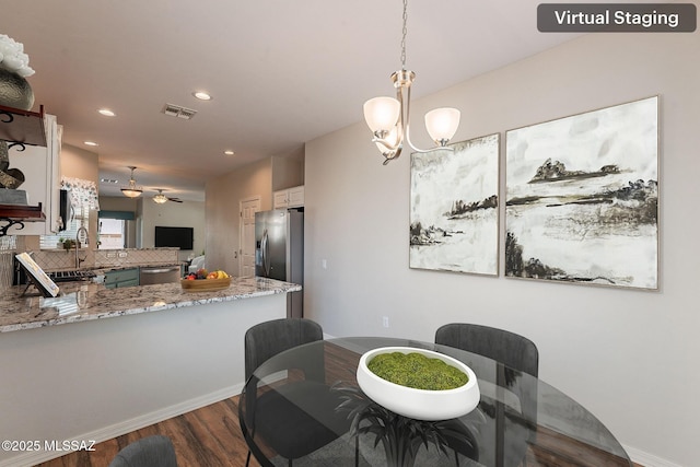 dining area with a notable chandelier, baseboards, recessed lighting, visible vents, and dark wood finished floors