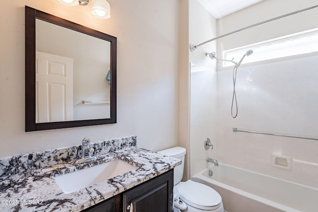 bathroom with toilet, bathing tub / shower combination, and vanity