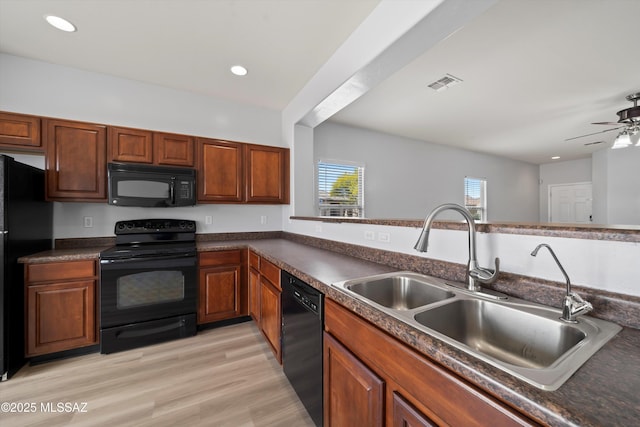 21700 E Governor Dr, Red Rock, AZ 85145 - kitchen featuring visible vents, a sink, dark countertops, a ceiling fan, and black appliances