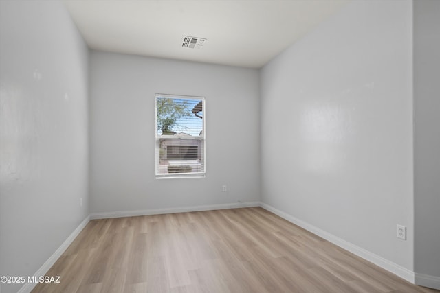 21700 E Governor Dr, Red Rock, AZ 85145 - unfurnished room with visible vents, baseboards, and light wood-style floors