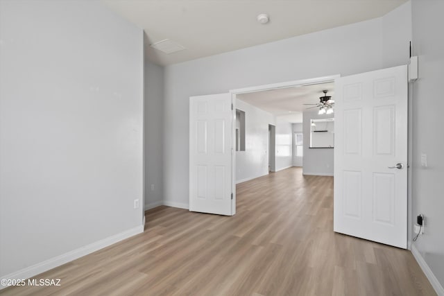 21700 E Governor Dr, Red Rock, AZ 85145 - empty room featuring light wood finished floors, ceiling fan, and baseboards