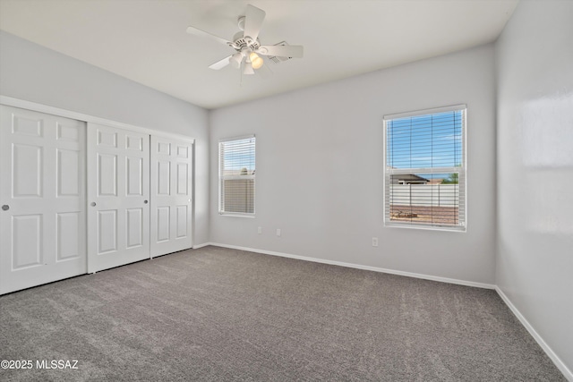 21700 E Governor Dr, Red Rock, AZ 85145 - unfurnished bedroom with a closet, baseboards, carpet flooring, and ceiling fan