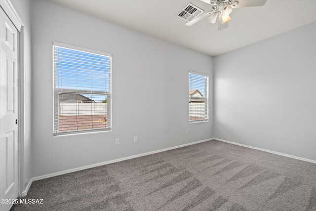 21700 E Governor Dr, Red Rock, AZ 85145 - empty room with visible vents, carpet floors, baseboards, and ceiling fan