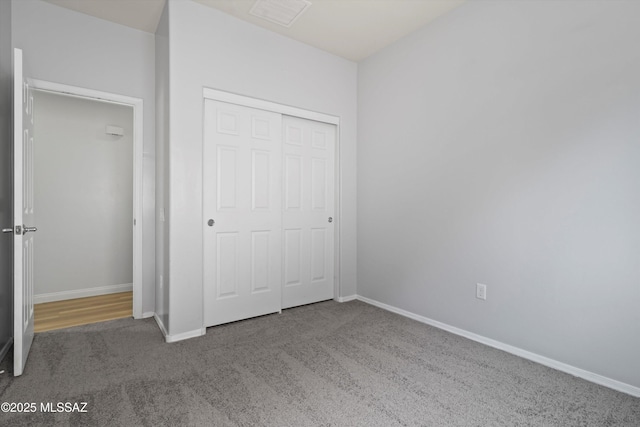 21700 E Governor Dr, Red Rock, AZ 85145 - unfurnished bedroom featuring a closet, carpet flooring, visible vents, and baseboards