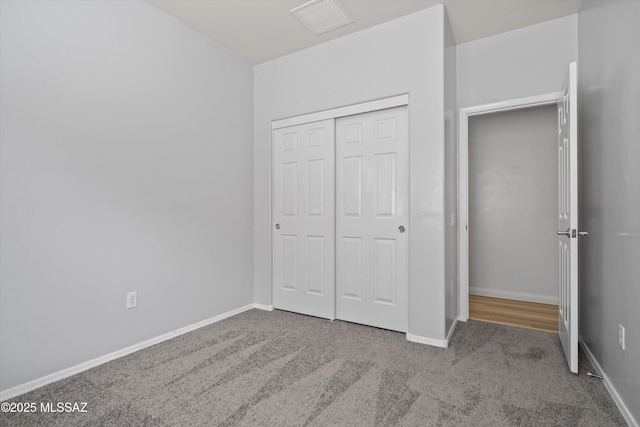 21700 E Governor Dr, Red Rock, AZ 85145 - unfurnished bedroom featuring visible vents, a closet, baseboards, and carpet floors