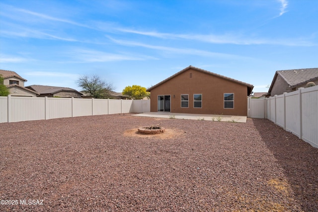 21700 E Governor Dr, Red Rock, AZ 85145 - back of property with a patio area, a fire pit, a fenced backyard, and stucco siding