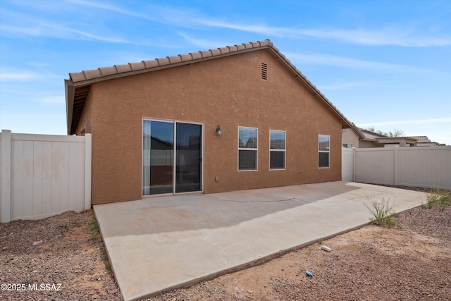 21700 E Governor Dr, Red Rock, AZ 85145 - back of property with a patio area, a tiled roof, fence, and stucco siding