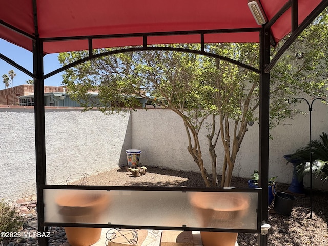 291 E Los Rincones, Green Valley, AZ 85614 - view of patio featuring a fenced backyard and glass enclosure