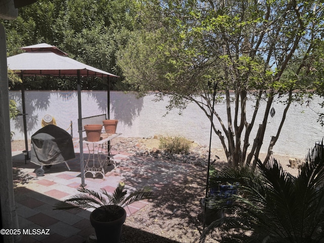291 E Los Rincones, Green Valley, AZ 85614 - view of patio / terrace with a water view, fence, and a grill