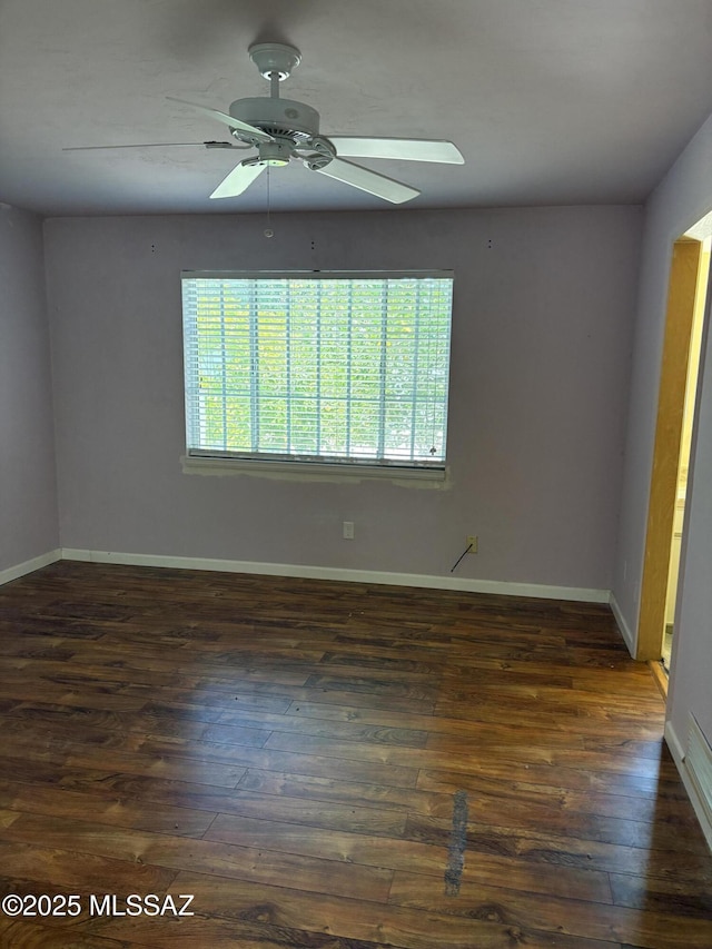 291 E Los Rincones, Green Valley, AZ 85614 - empty room with dark wood-style floors, baseboards, and a ceiling fan