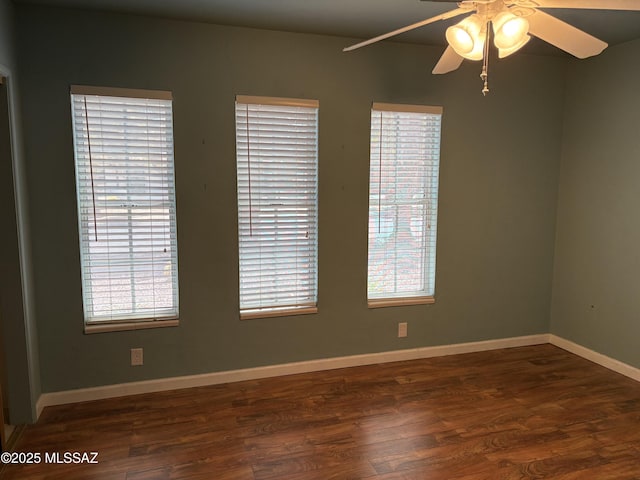 291 E Los Rincones, Green Valley, AZ 85614 - unfurnished room featuring wood finished floors, baseboards, a ceiling fan, and plenty of natural light
