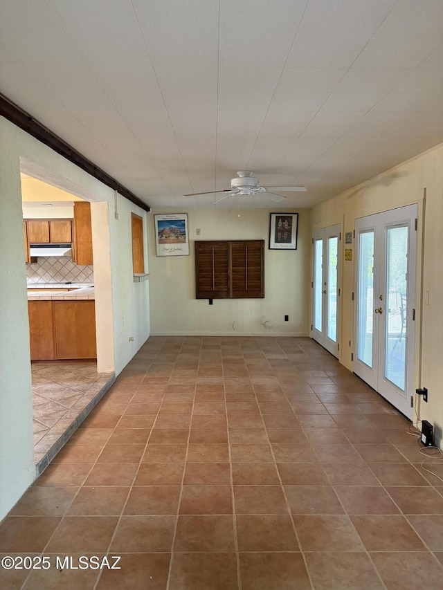 291 E Los Rincones, Green Valley, AZ 85614 - spare room featuring light tile patterned flooring and ceiling fan