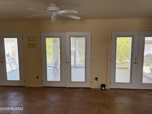 291 E Los Rincones, Green Valley, AZ 85614 - doorway featuring french doors, a ceiling fan, and a healthy amount of sunlight