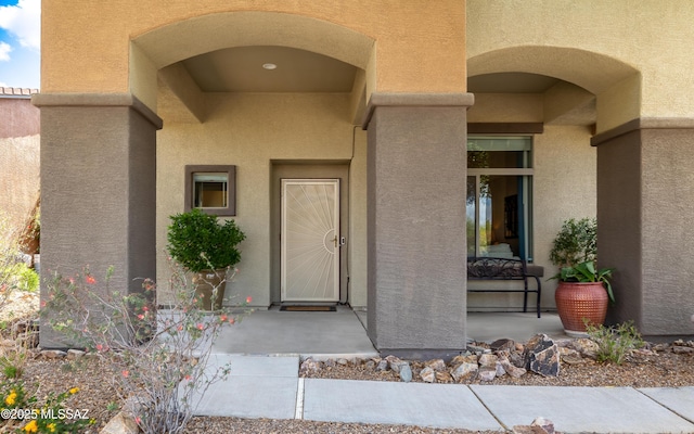 9125 S Crows Nest Ct, Tucson, AZ 85756 - doorway to property with stucco siding