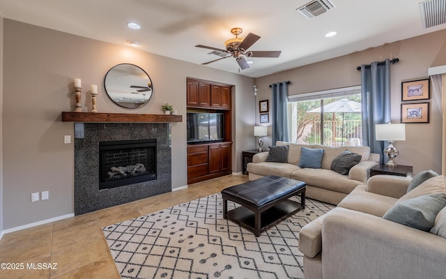 9125 S Crows Nest Ct, Tucson, AZ 85756 - living room with ceiling fan, a tile fireplace, baseboards, recessed lighting, and light tile patterned floors