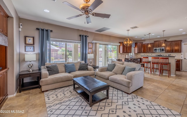 9125 S Crows Nest Ct, Tucson, AZ 85756 - living room with recessed lighting, ceiling fan, light tile patterned floors, and a chandelier