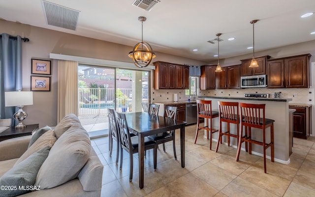 9125 S Crows Nest Ct, Tucson, AZ 85756 - dining space with plenty of natural light, recessed lighting, a chandelier, and light tile patterned floors