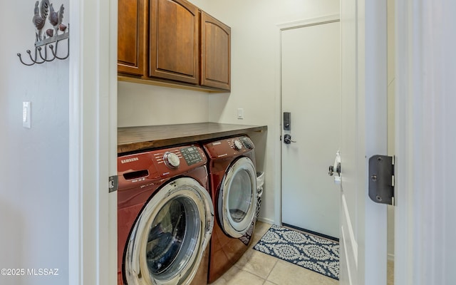 9125 S Crows Nest Ct, Tucson, AZ 85756 - washroom featuring cabinet space, washer and clothes dryer, and light tile patterned floors
