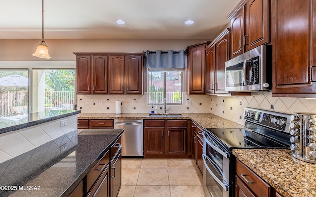 9125 S Crows Nest Ct, Tucson, AZ 85756 - kitchen with appliances with stainless steel finishes, a sink, plenty of natural light, pendant lighting, and recessed lighting