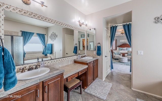 9125 S Crows Nest Ct, Tucson, AZ 85756 - bathroom featuring double vanity, baseboards, a stall shower, and a tub to relax in
