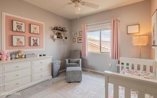 9125 S Crows Nest Ct, Tucson, AZ 85756 - bedroom featuring a nursery area, light colored carpet, baseboards, and a ceiling fan