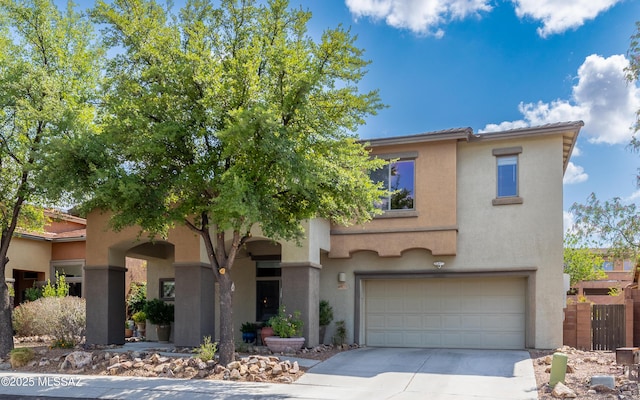 9125 S Crows Nest Ct, Tucson, AZ 85756 - view of front of house featuring a garage, stucco siding, concrete driveway, and a tiled roof