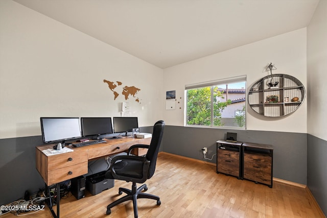 office featuring baseboards and wood finished floors