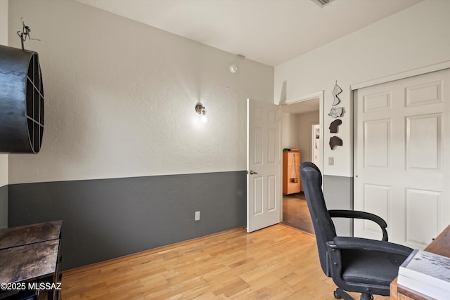 home office with light wood finished floors