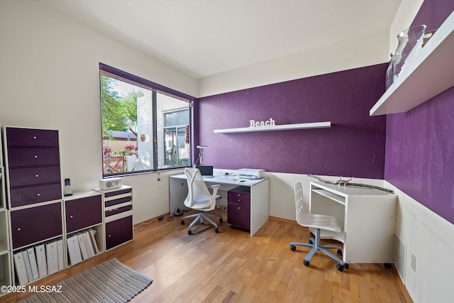 home office featuring visible vents and light wood finished floors
