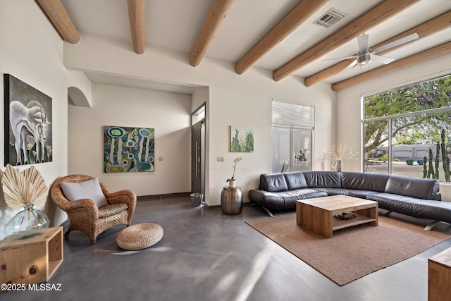 living area featuring visible vents, a ceiling fan, concrete floors, and beam ceiling