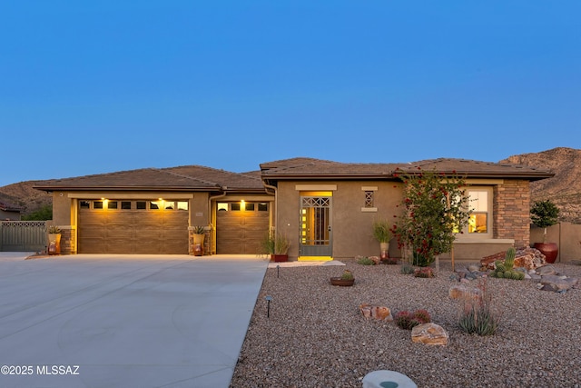 35605 S Overlook Dr, Saddlebrooke, AZ 85739 - prairie-style home with driveway, a garage, stucco siding, and fence