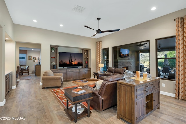 35605 S Overlook Dr, Saddlebrooke, AZ 85739 - living area with recessed lighting, a ceiling fan, visible vents, and a stone fireplace