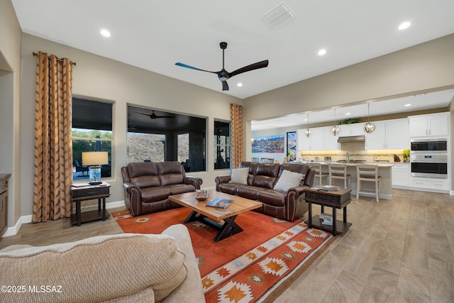 35605 S Overlook Dr, Saddlebrooke, AZ 85739 - living room with visible vents, a ceiling fan, light wood-style floors, and recessed lighting