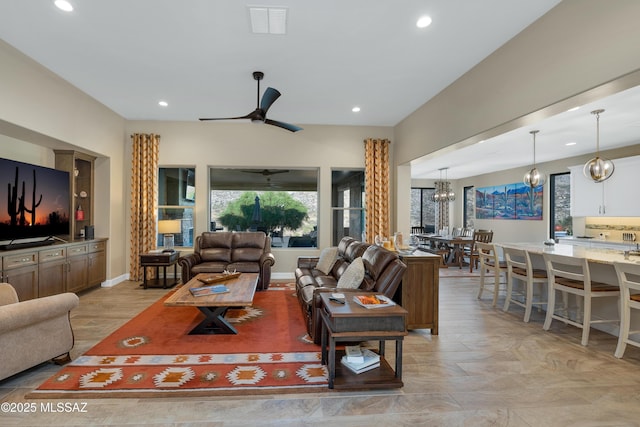 35605 S Overlook Dr, Saddlebrooke, AZ 85739 - living area featuring visible vents, recessed lighting, baseboards, and ceiling fan with notable chandelier