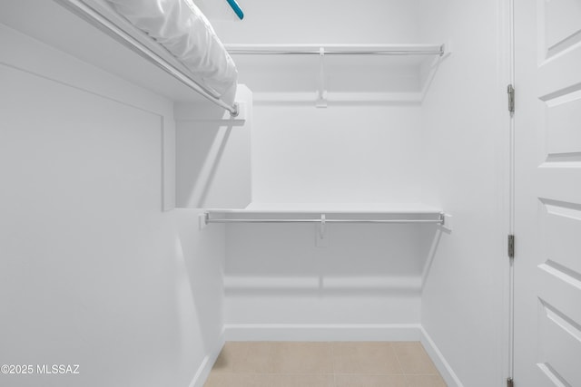 35605 S Overlook Dr, Saddlebrooke, AZ 85739 - spacious closet featuring light tile patterned floors